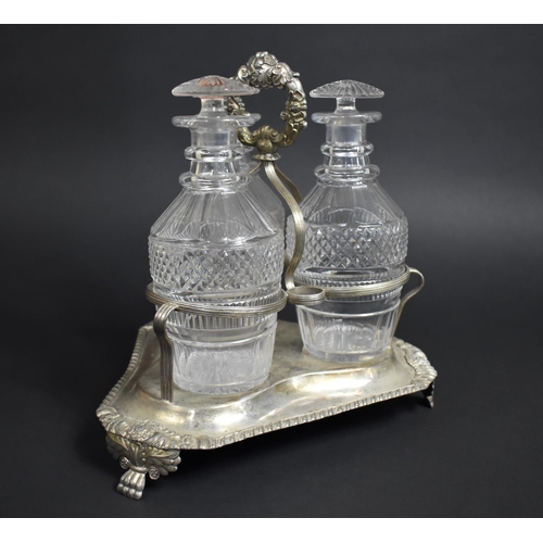 257 - A Georgian Three Bottle Tantalus on Silver Plated Stand, Glass Bottles of Mallet Form having Cut Hob... 