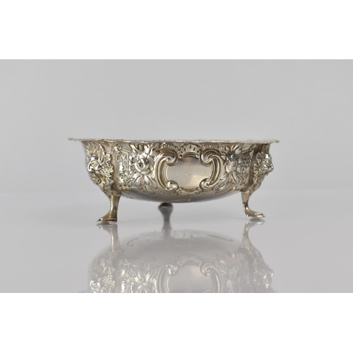 241 - A Victorian Silver Bowl with Three Lion Mask Scrolled Supports and Repousse Work Decoration, 12cms D... 