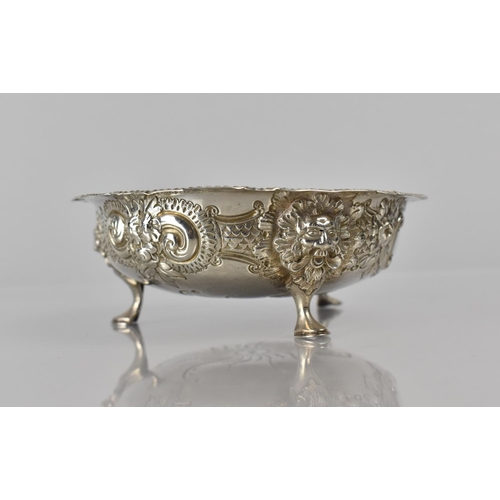 241 - A Victorian Silver Bowl with Three Lion Mask Scrolled Supports and Repousse Work Decoration, 12cms D... 