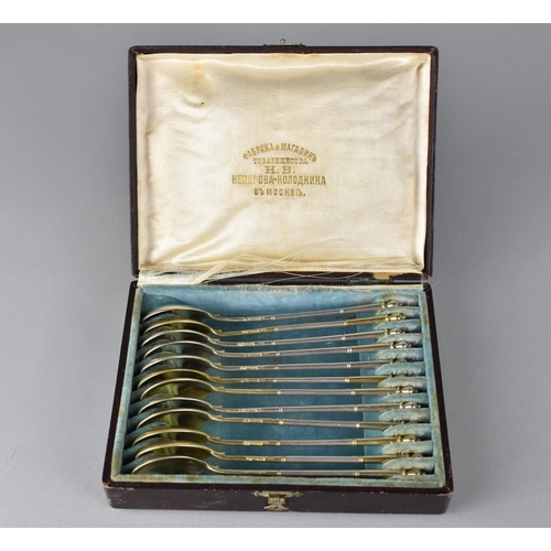 254 - A Cased Set of Twelve Russian Silver Gilt Coffee Spoons with Foliate Engraved Bowls, Stamped with Ma... 