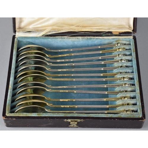 254 - A Cased Set of Twelve Russian Silver Gilt Coffee Spoons with Foliate Engraved Bowls, Stamped with Ma... 