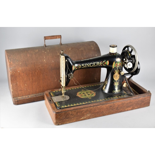 467 - An Early 20th Century Manual Singer Sewing Machine in Oak Case, Serial Number Y1016527