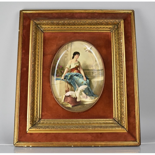 474 - A Continental Cushion Framed Oval Enamel Plaque in the Vienna Style depicting Seated Maiden with Coc... 