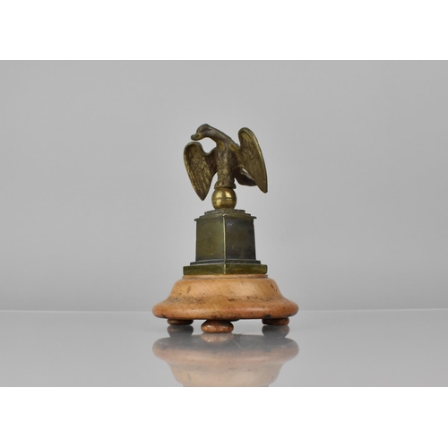 175 - A 19th Century Bronze Pocket Watch Holder in the Form of an Eagle with Wings Spread Perched on Ball ... 