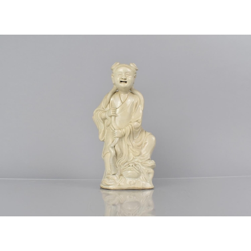 338 - An 18th/19th Century Chinese Blanc De Chine Study of Immortal Standing Upon Temple Lion, 18cms High.... 