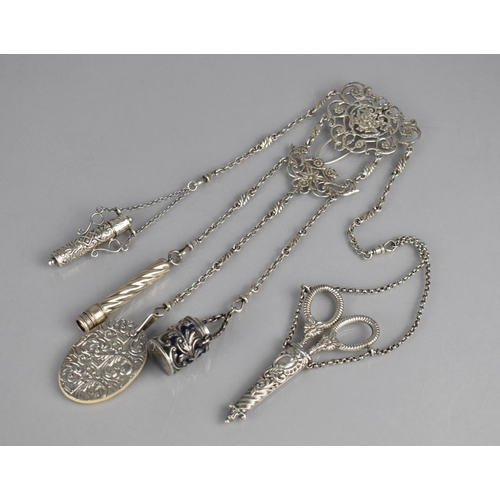 312 - A Victorian/Edwardian Silver Chatelain, The Ornate Clasp with Pierced Floral and Scrolled Design wit... 