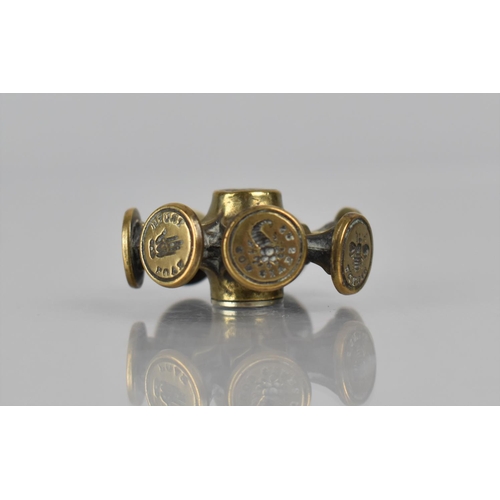 320 - A 19th Century Brass Eight Faced Seal Wheel of Ornate Design, 4cms Diameter. Condition: Not in perfe... 