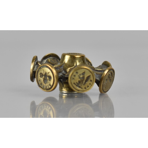 320 - A 19th Century Brass Eight Faced Seal Wheel of Ornate Design, 4cms Diameter. Condition: Not in perfe... 