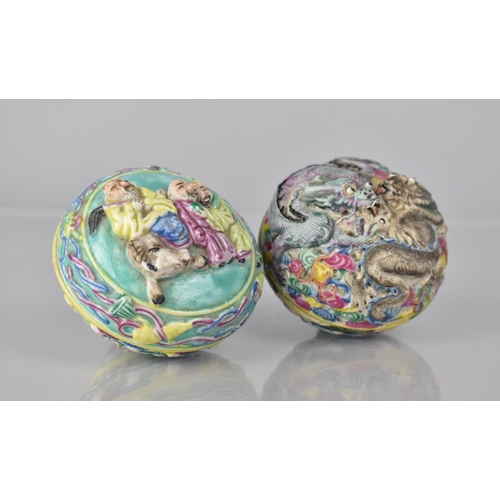 334 - Two 20th Century Chinese Famille Rose Decorated Lidded Pots both Decorated in High Relief, The One E... 