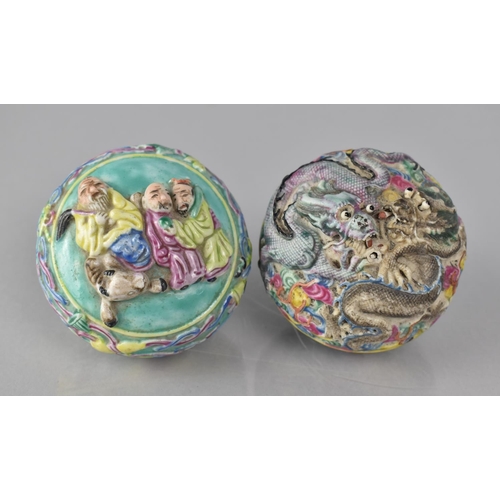 334 - Two 20th Century Chinese Famille Rose Decorated Lidded Pots both Decorated in High Relief, The One E... 