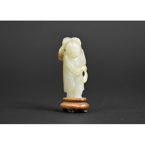 324 - A Chinese Carved Jade Study of an Immortal on Fitted Wooden Plinth, 7cms High. Condition:Not Perfect... 