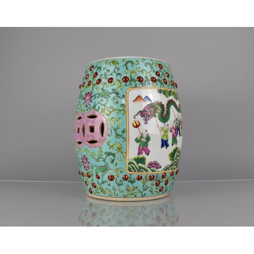 95 - A 20th Century Chinese Porcelain Miniature Stool of Barrel Form decorated in the Famille Rose Palett... 