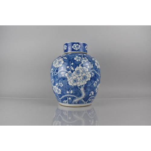 370 - A Large 19th/20th Century Chinese Porcelain Blue and White Prunus Pattern Jar and Cover, 30cms High,... 