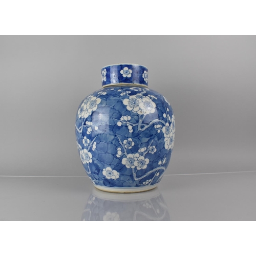 370 - A Large 19th/20th Century Chinese Porcelain Blue and White Prunus Pattern Jar and Cover, 30cms High,... 