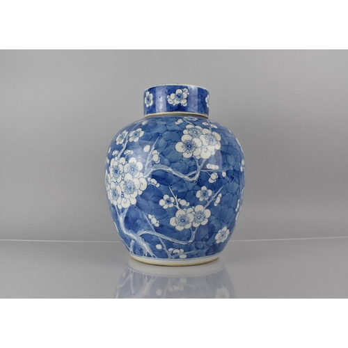 370 - A Large 19th/20th Century Chinese Porcelain Blue and White Prunus Pattern Jar and Cover, 30cms High,... 