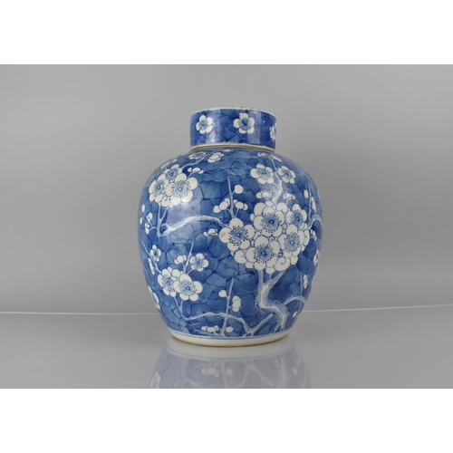 370 - A Large 19th/20th Century Chinese Porcelain Blue and White Prunus Pattern Jar and Cover, 30cms High,... 