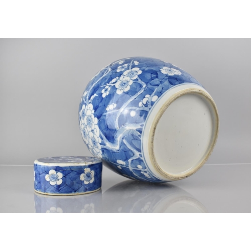 370 - A Large 19th/20th Century Chinese Porcelain Blue and White Prunus Pattern Jar and Cover, 30cms High,... 