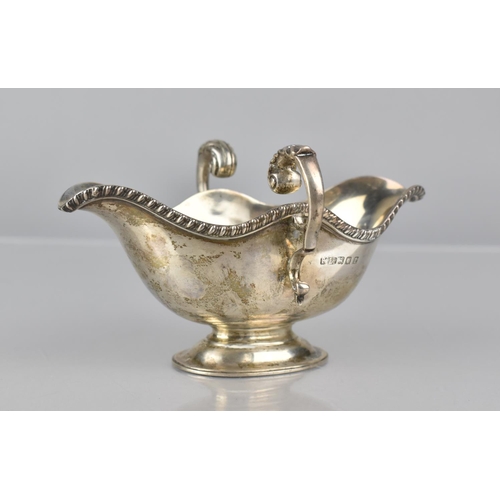 221 - A Victorian Silver Two Handled and Lipped Sauce Boat by Finnigans Ltd, London, Hallmark 1860, 180gms