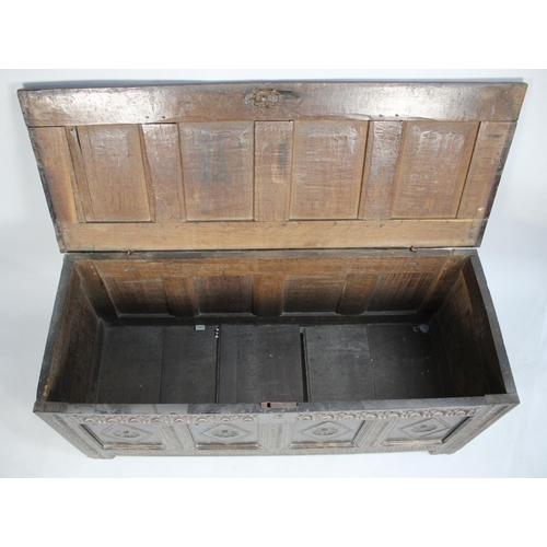 485 - An Early Oak Four Panel Lift Top Coffer Chest with Carved Lozenge Decoration