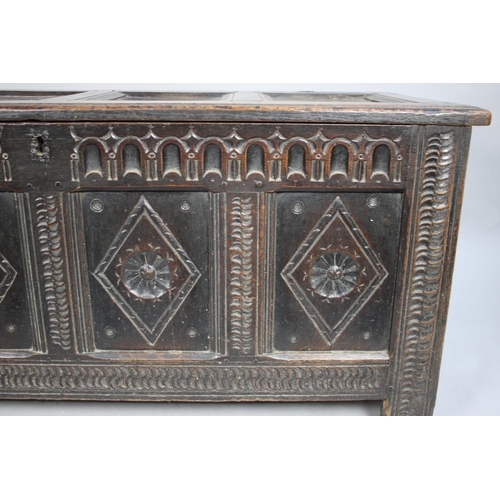 485 - An Early Oak Four Panel Lift Top Coffer Chest with Carved Lozenge Decoration