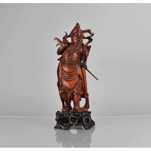 422 - A Nicely Carved Chinese Wooden and Varnished Study of Guan Yu on Pierced Naturalistic Stand, 27cms H... 