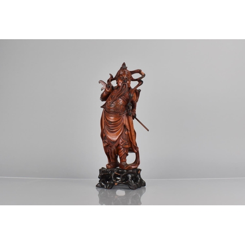 422 - A Nicely Carved Chinese Wooden and Varnished Study of Guan Yu on Pierced Naturalistic Stand, 27cms H... 