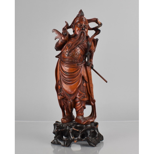 422 - A Nicely Carved Chinese Wooden and Varnished Study of Guan Yu on Pierced Naturalistic Stand, 27cms H... 