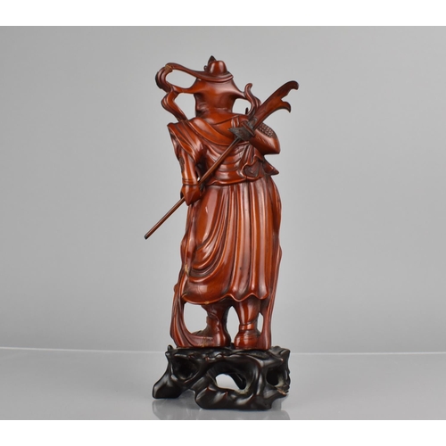 422 - A Nicely Carved Chinese Wooden and Varnished Study of Guan Yu on Pierced Naturalistic Stand, 27cms H... 