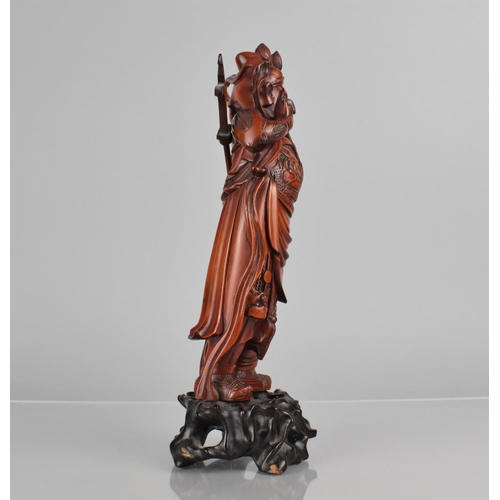 422 - A Nicely Carved Chinese Wooden and Varnished Study of Guan Yu on Pierced Naturalistic Stand, 27cms H... 