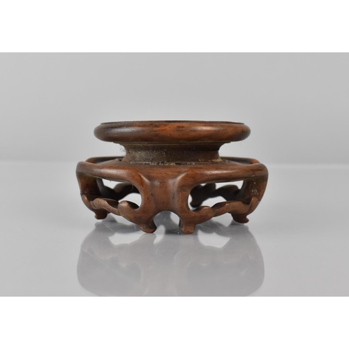 425 - A Small Chinese Hardwood Stand with Moulded and Pierced Sides to Fit 6cms Base Max Diameter 8cms and... 