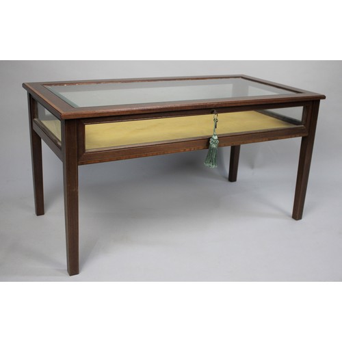 83 - A Crossbanded Rectagular Bijouterie Coffee Table, 88x45x46cm high