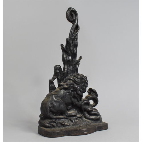 10 - A 19th Century Black Painted Cast Iron Door Porter Depicting Lion and Snake, 37cms High