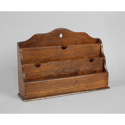 11 - An Edwardian Oak Three Division Stationery Rack, 31cms Wide