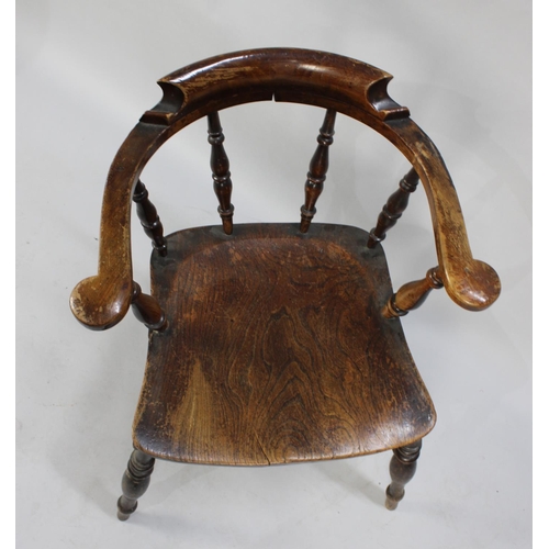 138 - A Vintage Elm Seated Smokers Bow Armchair