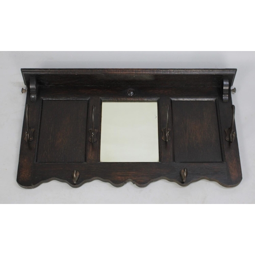 146 - An Edwardian Oak Wall Hanging Mirrored Shelf with Six Coat Hooks, 70cms Wide