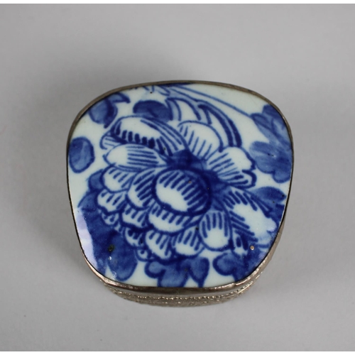 18 - A Far Eastern White Metal Bowl with Blue and White Glazed Ceramic Lid Depicting Flowers, 8.5cms Wide