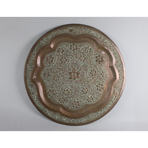 194 - An Islamic Circular Wall Hanging Charger with Foliate Decoration