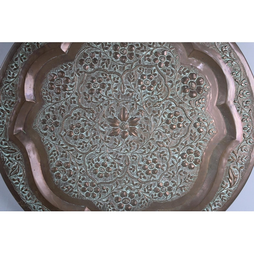 194 - An Islamic Circular Wall Hanging Charger with Foliate Decoration