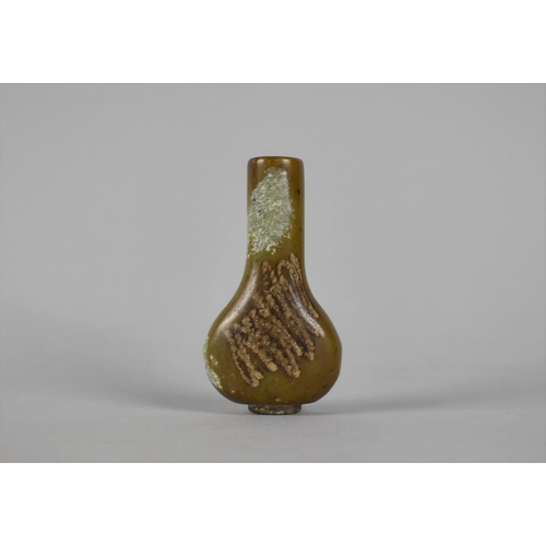 209 - A Carved Hardstone Snuff Bottle, 8cm high