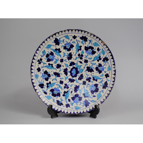 210 - A Glazed Charger Decorated in Blue Enamels in the Iznik Style 30cm Diameter