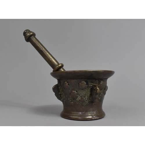 24 - A Late 17th/Early 18th Century Bronze Pestle and Mortar, Body Moulded with Seashells, 11.5cms Diamet... 