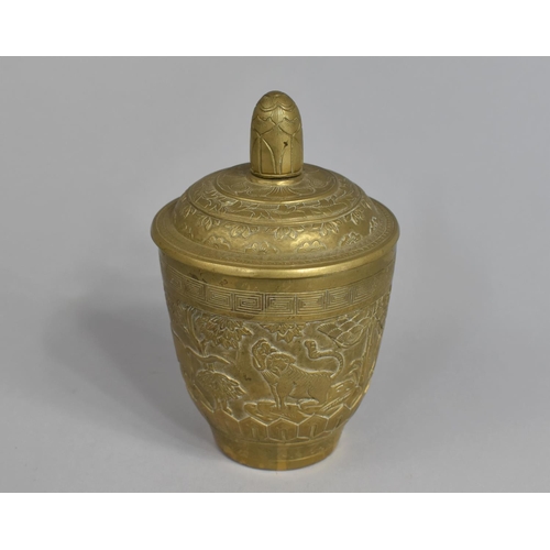 25 - A Heavy Chinese Brass Pot and Cover decorated in Relief with Elephant, Lion and Other Animals, 13cms... 