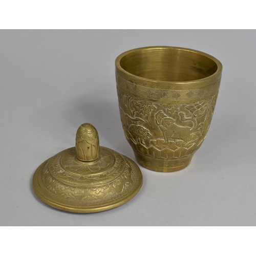 25 - A Heavy Chinese Brass Pot and Cover decorated in Relief with Elephant, Lion and Other Animals, 13cms... 