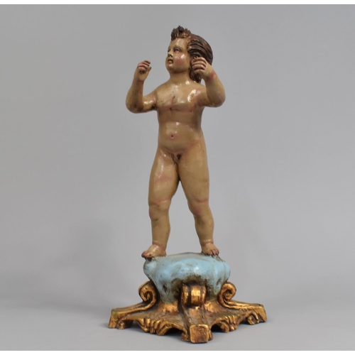 26 - A Restored French Figure of Naked Child on Cushion, 34cms High