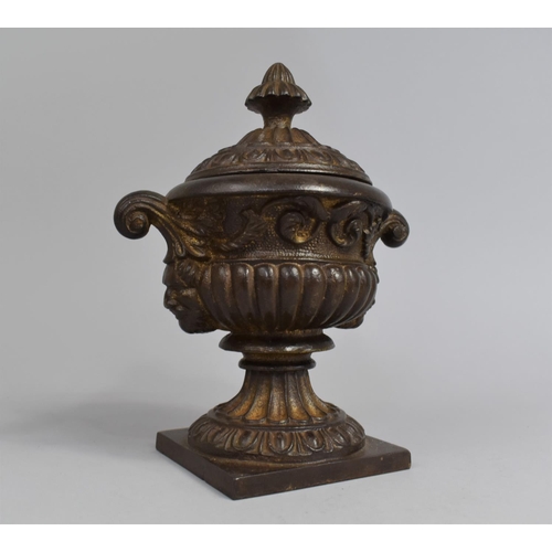 37 - A Bronzed Cast Iron Two Handled Lidded Urn, 19th Century, 23cms High