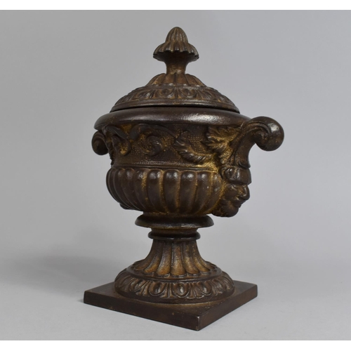 37 - A Bronzed Cast Iron Two Handled Lidded Urn, 19th Century, 23cms High