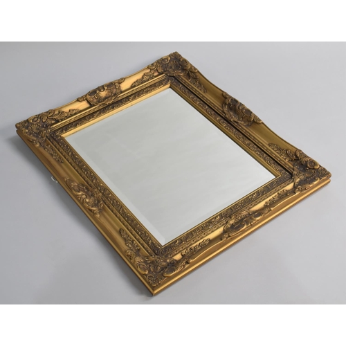 376 - An Ornate Gilt Framed Bevel Edge Wall Mirror, 60x70cm high