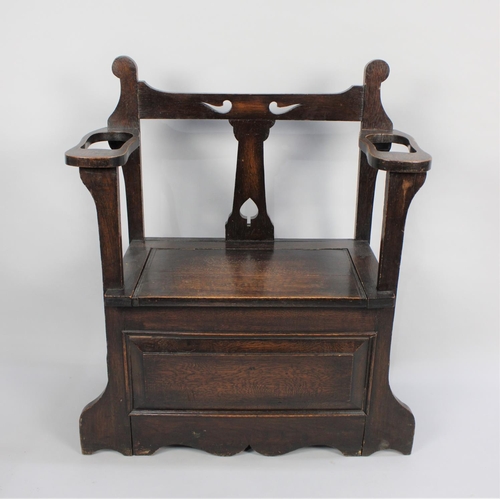 45 - An Edwardian Oak Hall Seat and Stick Stand with Hinged Lid and Pierced Top Rail, 76cms Wide