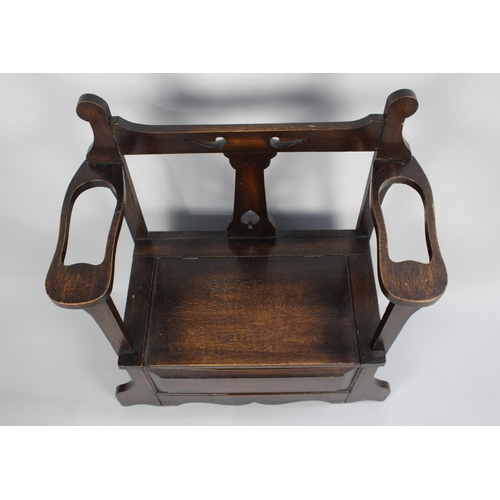 45 - An Edwardian Oak Hall Seat and Stick Stand with Hinged Lid and Pierced Top Rail, 76cms Wide