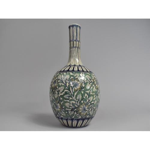 55 - A Persian Bottle Vase with Floral Decoration in Green and Blue Enamels, 32cms High